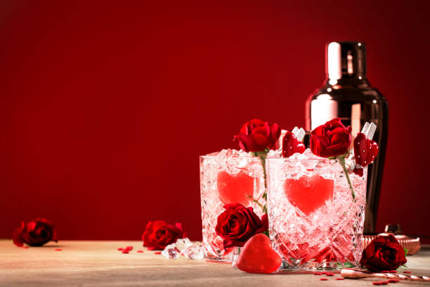 Roses julep Valentine's day cocktail with red roses and hearts on a festive background Roses julep Valentine's day cocktail with red roses and hearts on a festive background mint julep photos stock pictures, royalty-free photos & images