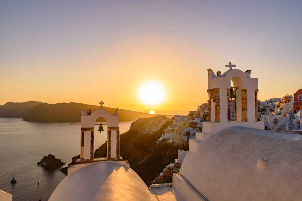 istock Bell tower with warm sunset light in Oia, Santorini, Greece 1198968203