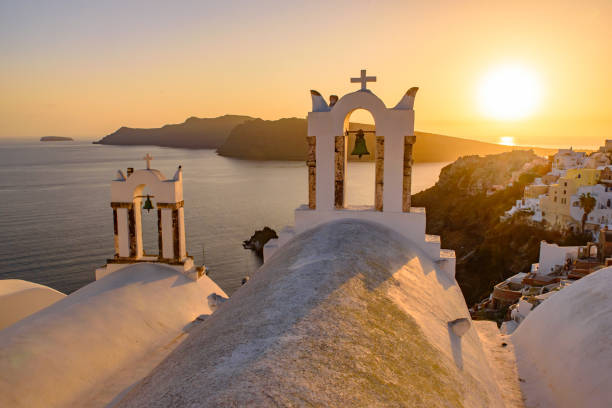 istock Bell tower with warm sunset light in Oia, Santorini, Greece 1198968347