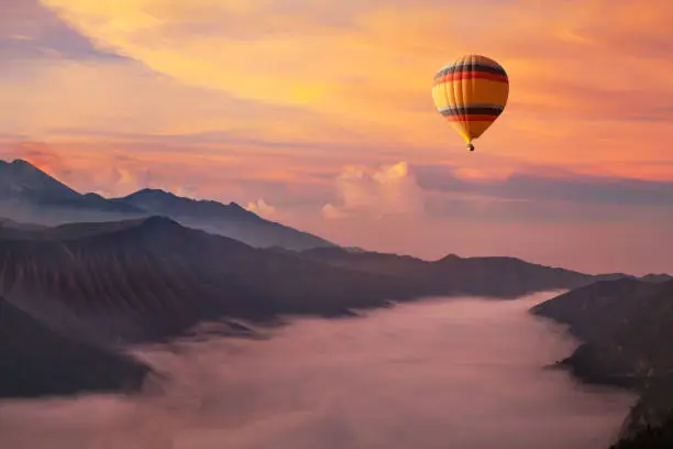 travel on hot air balloon, beautiful inspirational landscape with sunrise colorful sky