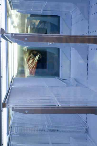 istock empty refrigerator shelves in the supermarket 1198971633