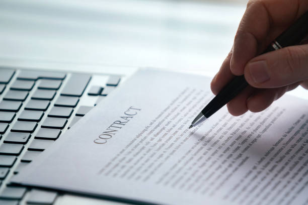 istock contract reading, legal advice, business agreement printed document 1198972528