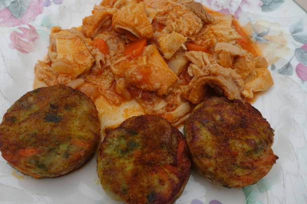 istock Tripe in tomato sauce served with vegetable croquettes 1198974987