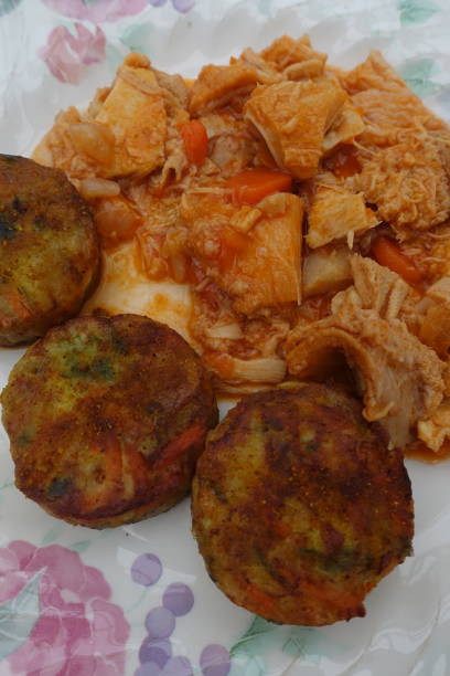 istock Tripe in tomato sauce served with vegetable croquettes 1198974992