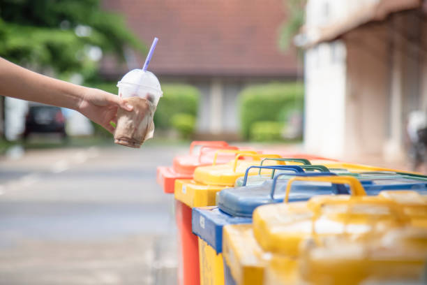 istock Hand  throwing take away plastic waste in to the recycle garbage.Separating plasatic materials from the garbages recycling concept. 1198975275