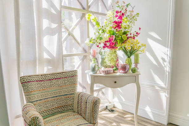 istock Easter interior decoration. Beatuful composition with candles. eggs, rabbit, apples and blooming flowers. 1198976095
