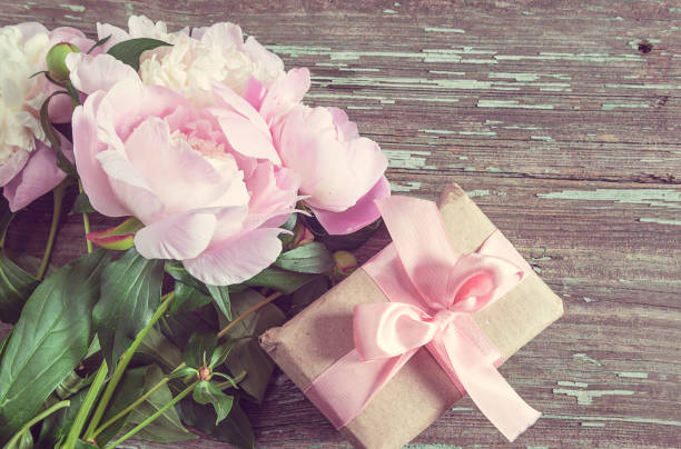 istock Romantic greeting card with pink peonies and handmade gift box 1198977208