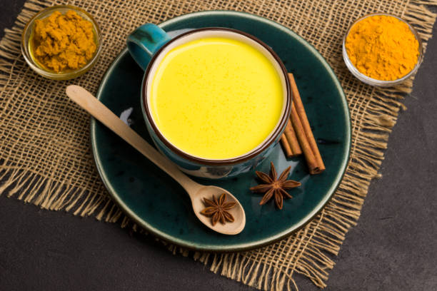 istock Herbal therapy concept.  Golden latte with ingredients for cooking 1198978717