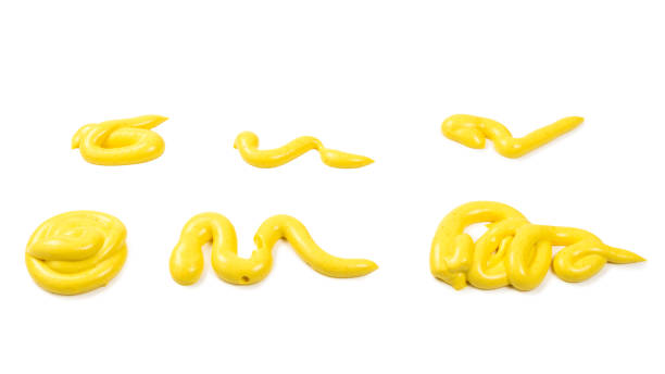 istock Yellow cheese sauce splashes isolated on white background 1198981009