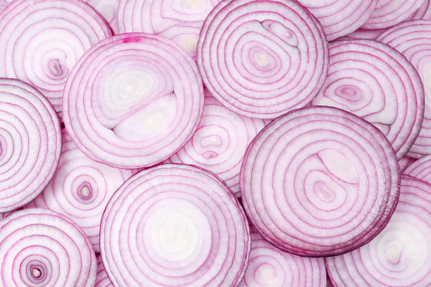 istock Onion slices as a background. Top view. 1198981031