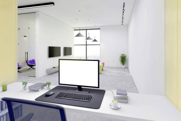 istock office desk with blank computer monitor in open plan office interior 1198981139