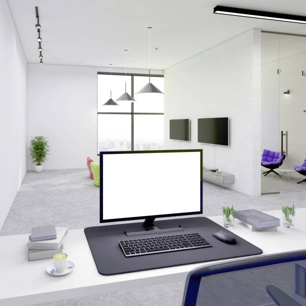 istock office desk with blank computer monitor in open plan office interior 1198981143