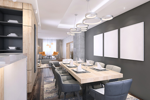 Modern dining room interior with large wooden table with chairs and black wall with whiteboards for copy space and living room in the background. Render.