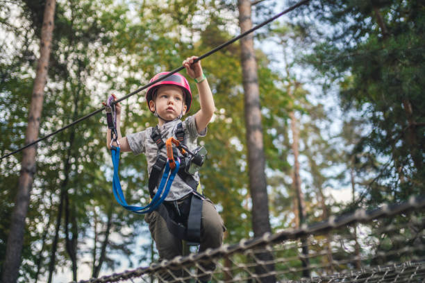 istock Cute little boy in an adventure park 1198982837