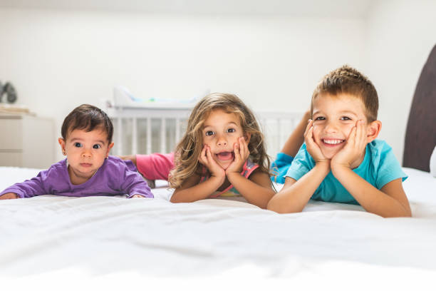 istock Happy playful kids in bedroom 1198982898