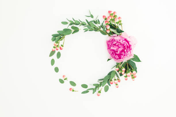 istock Found frame of pink peony flower, hypericum and eucalyptus on white background. Flat lay, top view 1198983512