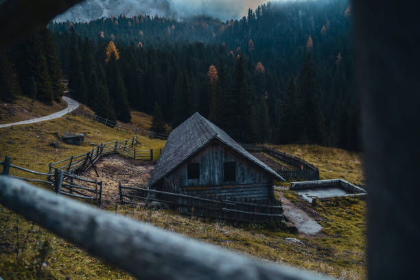 Cloudy conditions in Italy Alps: Abandoned Old Mountain Pasture South Tyrol during autumn