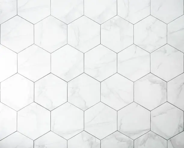 Photo of Tiles. A white marble wall with hexagon tiles for texture and background.