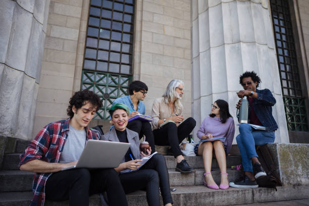 istock Group of students have outdoors class with professor 1198985079
