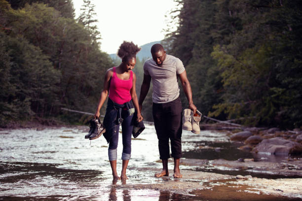 istock Couple Enjoying a Walk Along a River 1198985108