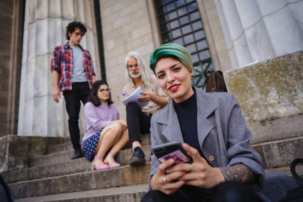 istock Female student chatting on smart phone 1198985136