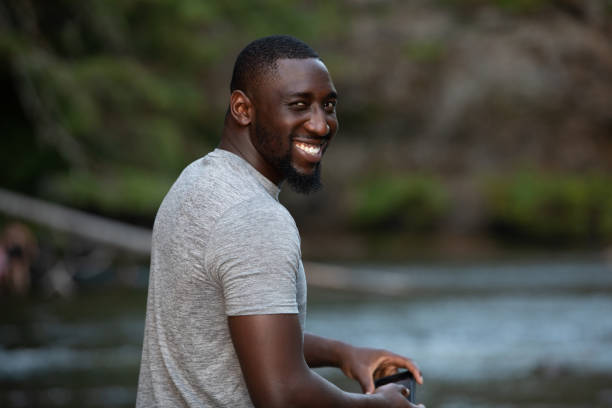 istock Man Enjoying the Outdoors in a Beautiful Setting 1198985288