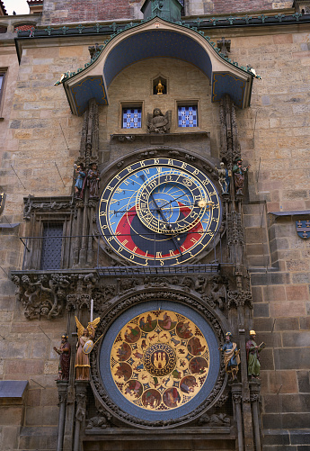 Vintage scene of Prague historical astronomic watch at city central square on Old Town Hall. Photo of colorful European city of Prague in Czech Republic daytime, travel in tourist place.