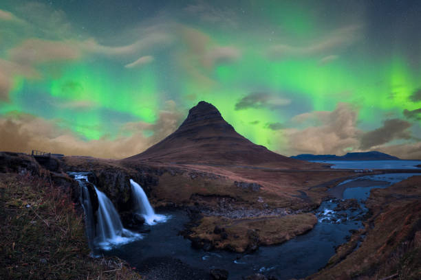 Green Aurora Borealis over Kirkjufell in Snaefellsnes in Iceland stock photo