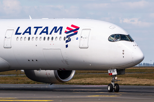 Paris, France - August 17, 2018: Latam Airlines Airbus A350 airplane at Paris Charles de Gaulle airport (CDG) in France. Airbus is an aircraft manufacturer from Toulouse, France.