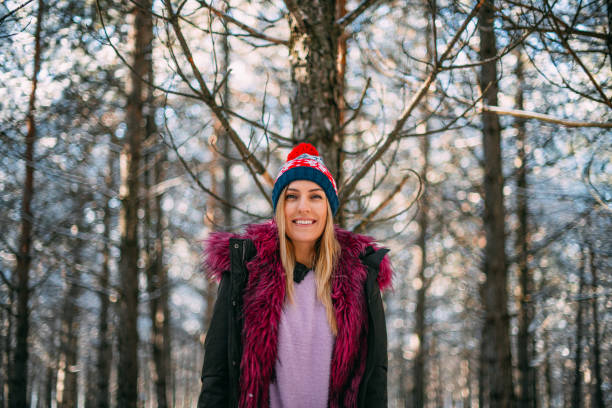 Cute woman in Snowy Forest