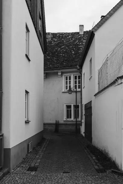 old street alley in black and white in a village in germany