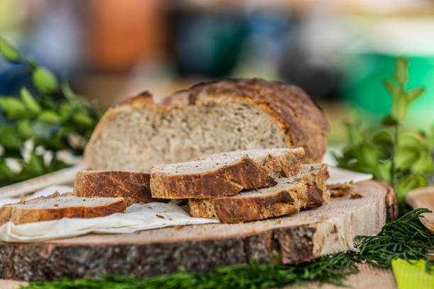 istock Loaf of fresh bread on wooden surface 1198997746