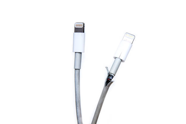 The broken and frayed cable from the charger for the smart phones. The broken and frayed cable from the charger for the smart phones. Typical problem of the users. Compared with the good one. phone charger cable stock pictures, royalty-free photos & images