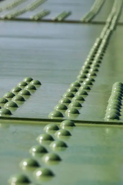 Photo of Metal parts of the rivet joints and bolts of the bridge