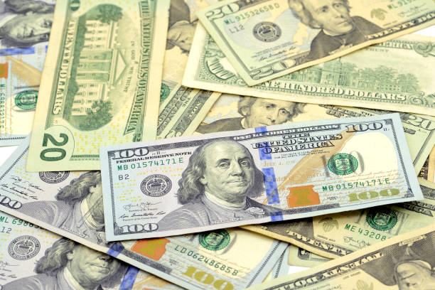 istock US dollar bank notes in full frame background. finance theme. 1199001835