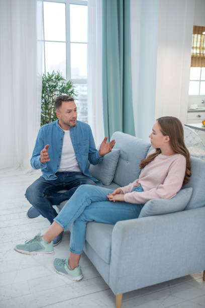 istock Caring father seriously speaking to his daughter. 1199002545