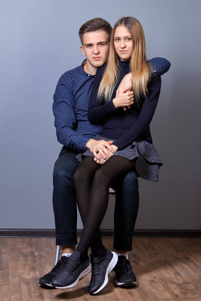 istock Girl sits at the guy on his knees. 1199003704