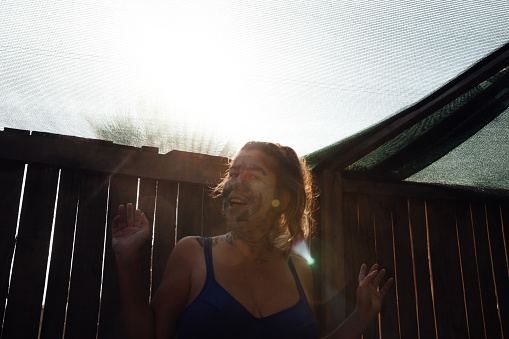 Portrait of young woman make to mud therapy