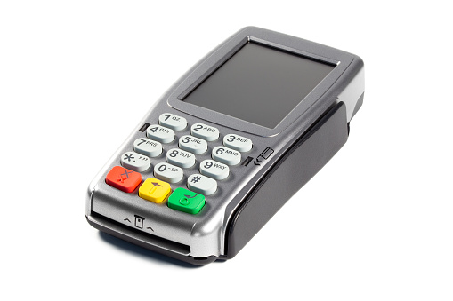 Modern payment terminal on a white background closeup, isolated