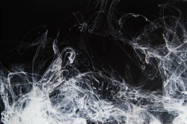 istock Backgound with fine structure of white smoke on black background. 1199008354