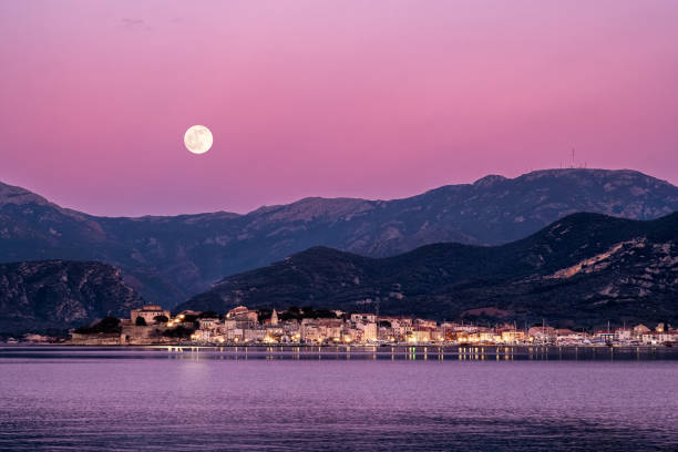 istock Full moon rising over St Florent in Corsica 1199008758