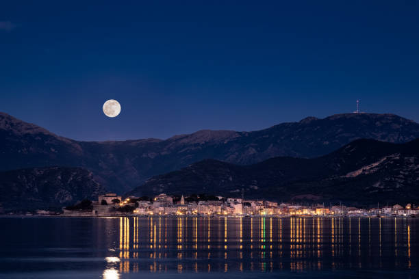 istock Full moon over St Florent in Corsica 1199008762