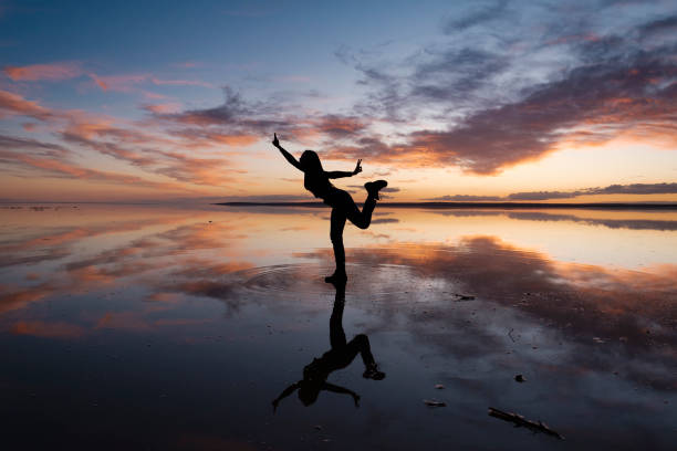 istock Dancing woman on salty lake. 1199008952