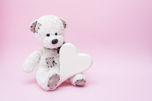 istock Teddy Bear with Love Heart on pink Background, copy space 1199008992