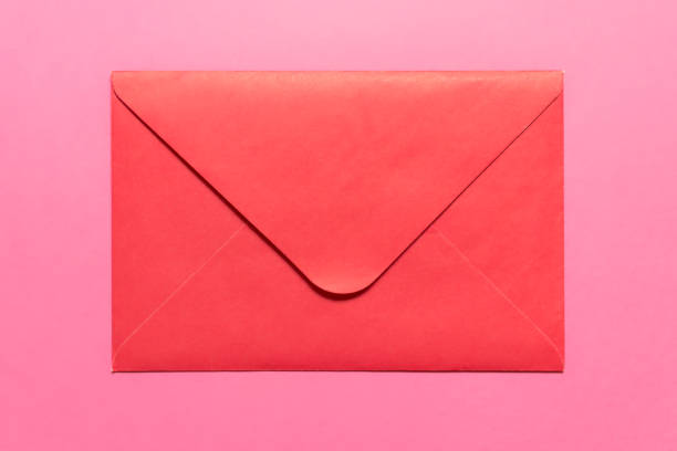 istock Closed pink envelope on pink background 1199009850