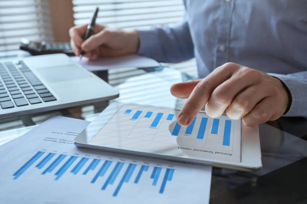 businessman working with financial report charts, business analytics and KPI businessman working with financial report charts, business analytics and KPI, finance concept measuring stock pictures, royalty-free photos & images