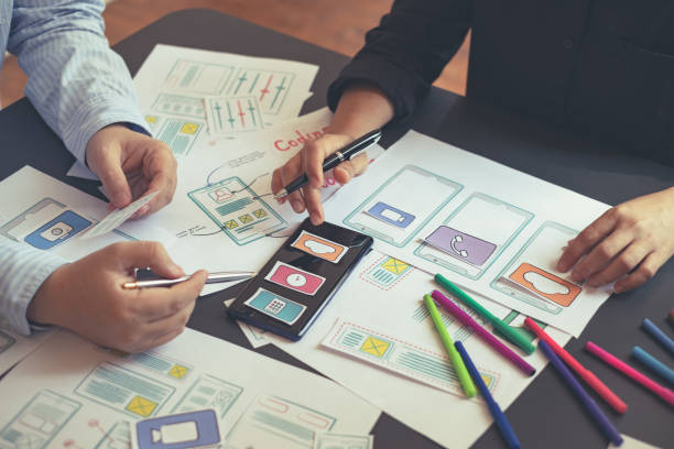 istock Teamwork graphic designers creative drawing website ux app development and application for mobile phone in the office. 1199011558