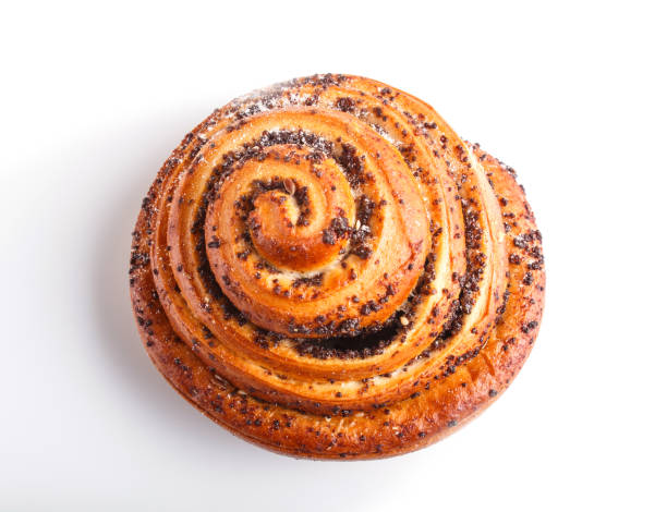 one bun with poppy seeds isolated on white background. top view.
