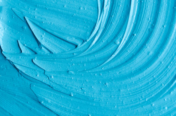 istock Light blue facial clay (mask, face cream, body wrap) texture close up, selective focus. Abstract background with brush strokes. 1199014678