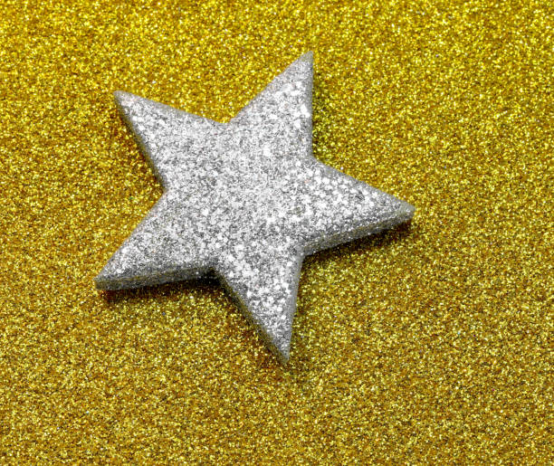 istock Silver Star on the glitter golden background 1199014951